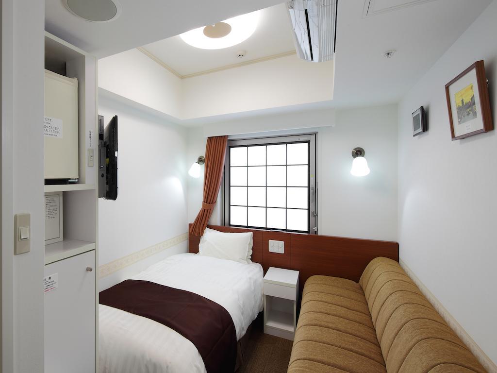 Hotel Check In Shijokarasuma à Kyoto Chambre photo
